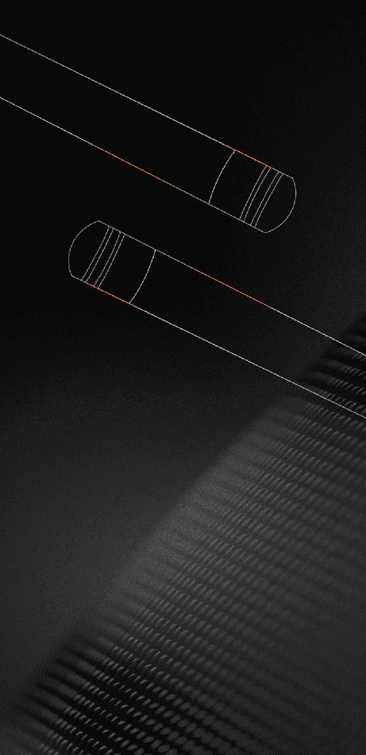 Two cylindrical objects on a textured black surface