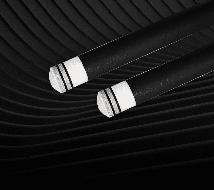 Two white cylindrical objects on a black textured background